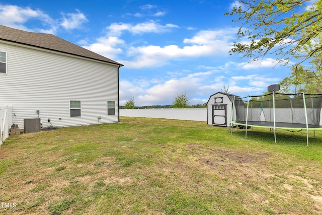 108 Bonnie Girl Ct, Lillington, NC 27546 - view of yard featuring an outbuilding, a shed, cooling unit, fence, and a trampoline