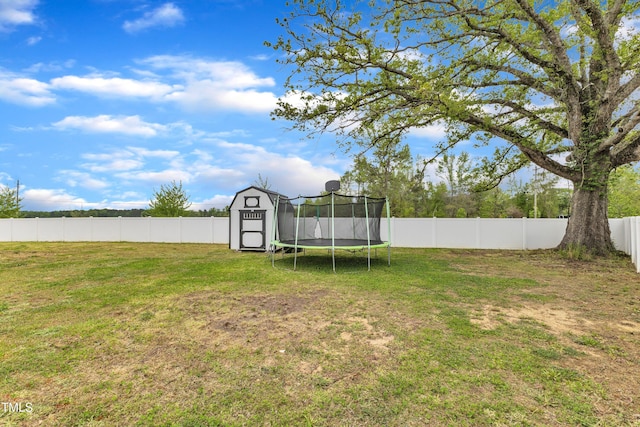 108 Bonnie Girl Ct, Lillington, NC 27546 - view of yard with a trampoline, a shed, a fenced backyard, and an outdoor structure