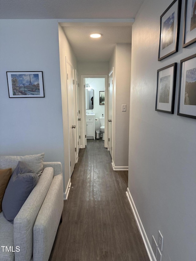 corridor with dark wood-type flooring