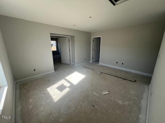 unfurnished bedroom featuring baseboards