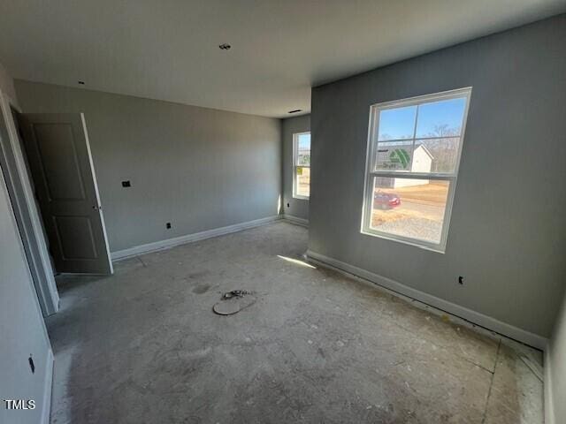 empty room with baseboards