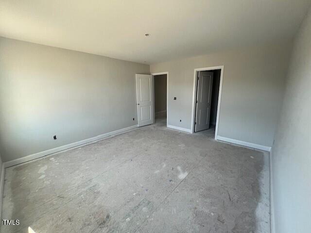 unfurnished bedroom with baseboards