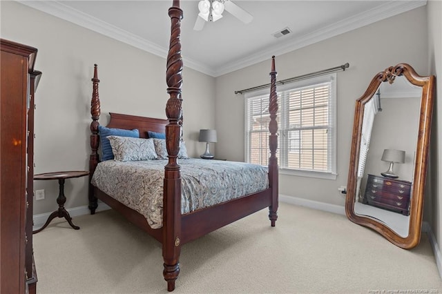 carpeted bedroom featuring crown molding and ceiling fan