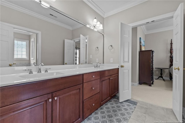 bathroom featuring crown molding, tile patterned floors, and vanity