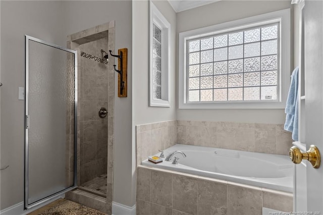 bathroom featuring shower with separate bathtub