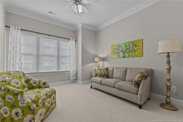 living room with crown molding, light colored carpet, and ceiling fan