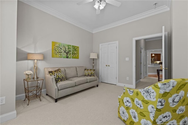 living room with crown molding, ceiling fan, and carpet flooring