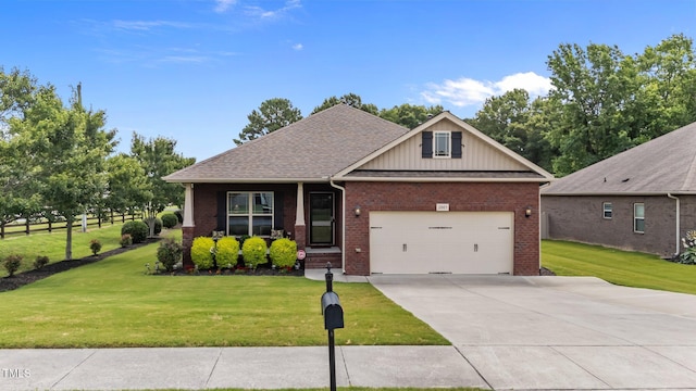 2001 Bunnfield Dr, Zebulon, NC 27597 - view of front of home with brick siding, driveway, a front lawn, an attached garage, and board and batten siding