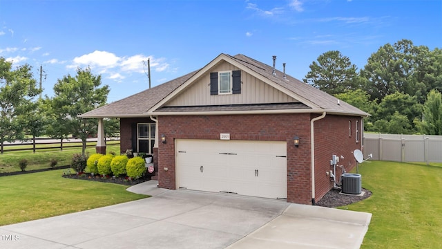 2001 Bunnfield Dr, Zebulon, NC 27597 - view of front of property featuring board and batten siding, brick siding, driveway, a shingled roof, and an attached garage