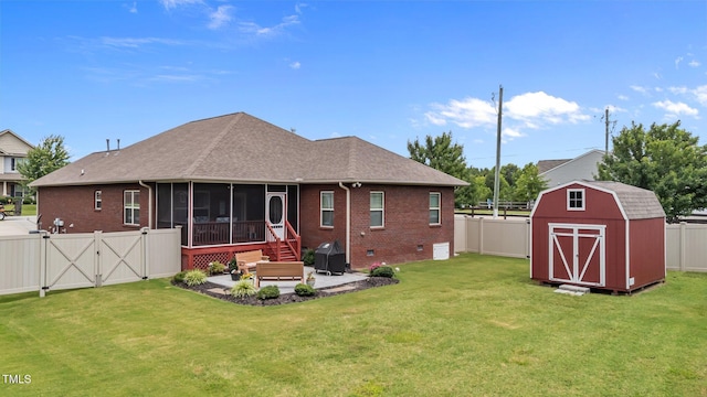 2001 Bunnfield Dr, Zebulon, NC 27597 - back of house with a sunroom, brick siding, a patio area, and a fenced backyard
