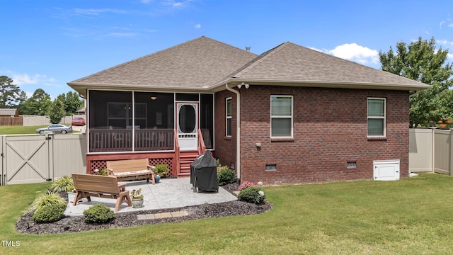 2001 Bunnfield Dr, Zebulon, NC 27597 - rear view of property featuring roof with shingles, a patio area, a gate, a sunroom, and brick siding