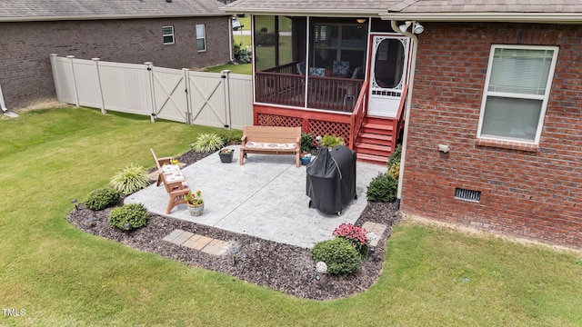 2001 Bunnfield Dr, Zebulon, NC 27597 - view of patio / terrace with a sunroom, a gate, and a grill