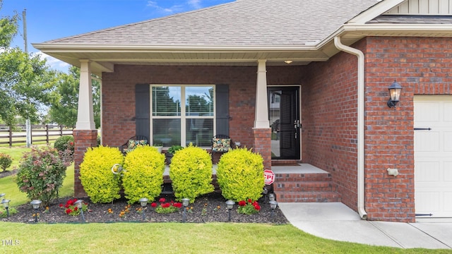 2001 Bunnfield Dr, Zebulon, NC 27597 - view of exterior entry with brick siding, covered porch, and a garage