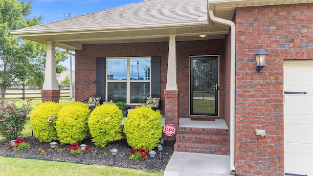 2001 Bunnfield Dr, Zebulon, NC 27597 - entrance to property with brick siding, roof with shingles, and a porch