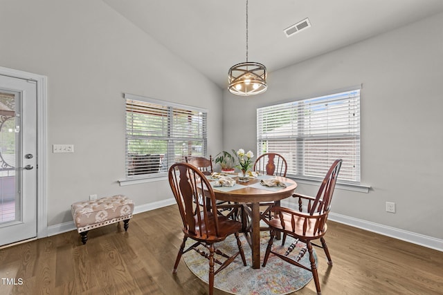 2001 Bunnfield Dr, Zebulon, NC 27597 - dining area featuring wood finished floors and high vaulted ceiling