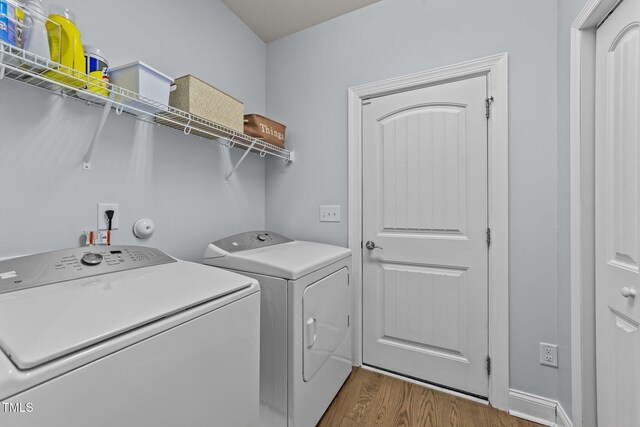 2001 Bunnfield Dr, Zebulon, NC 27597 - washroom with independent washer and dryer and wood finished floors