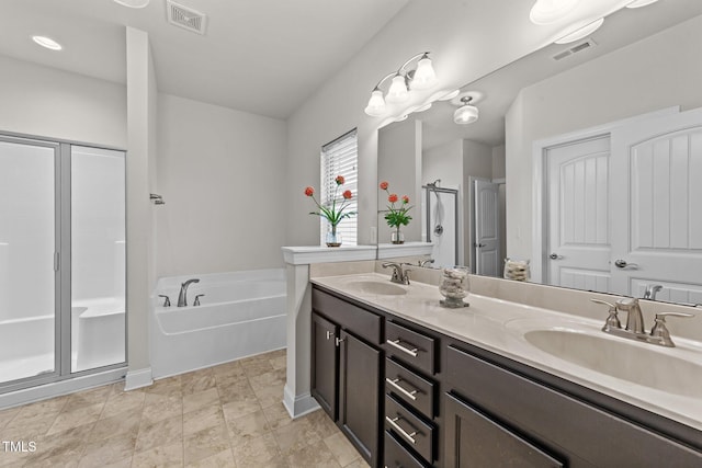 2001 Bunnfield Dr, Zebulon, NC 27597 - bathroom featuring a shower stall, a garden tub, and double vanity