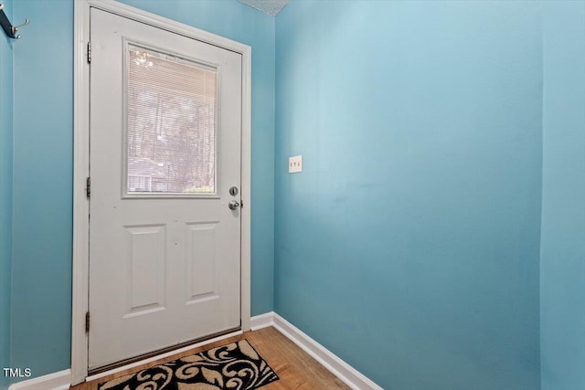 doorway to outside with hardwood / wood-style flooring