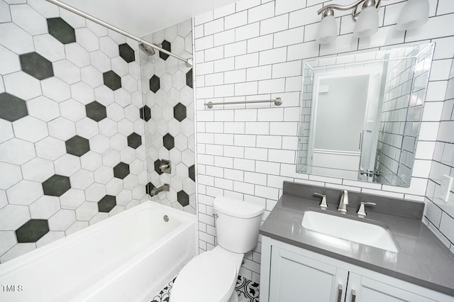 full bathroom with tile walls, tiled shower / bath combo, vanity, decorative backsplash, and toilet