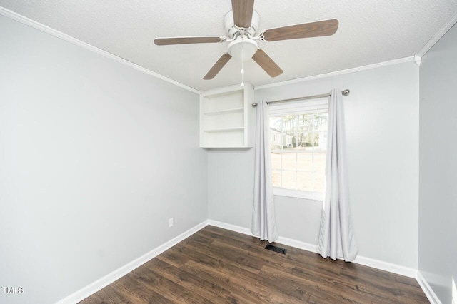 unfurnished room featuring ceiling fan, crown molding, dark hardwood / wood-style floors, and a textured ceiling