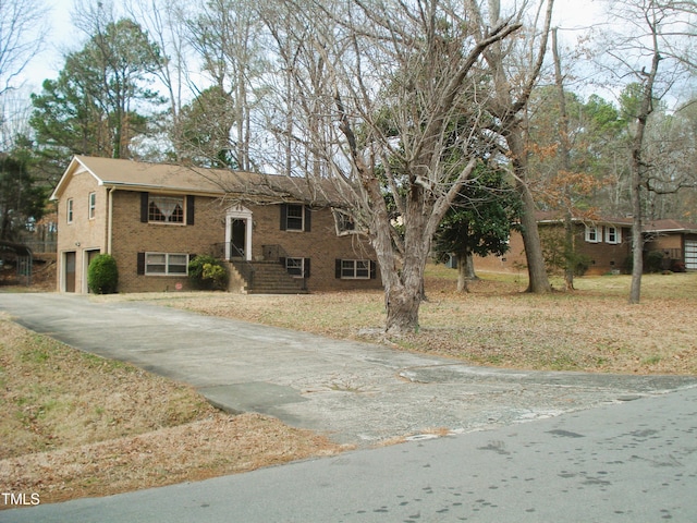 bi-level home featuring a garage