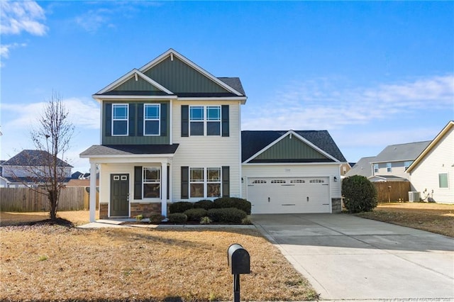 view of front of home with cooling unit and a garage