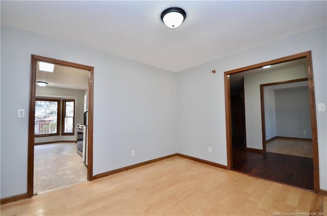 unfurnished room with light hardwood / wood-style flooring