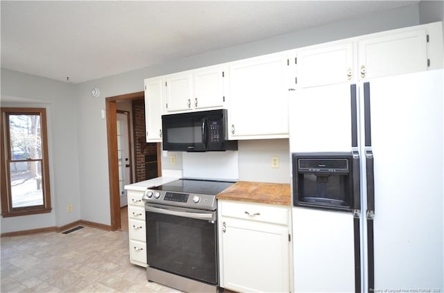 kitchen with white cabinetry, white refrigerator with ice dispenser, and electric range