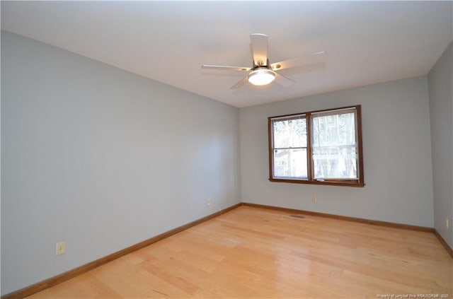 unfurnished room with ceiling fan and light hardwood / wood-style floors