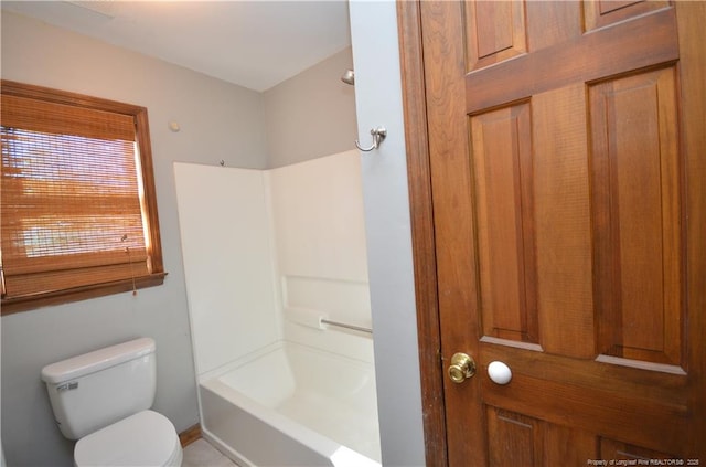 bathroom featuring  shower combination and toilet