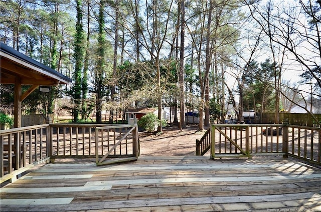 wooden deck featuring a shed