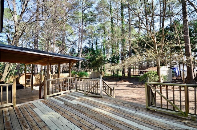 deck with a storage shed