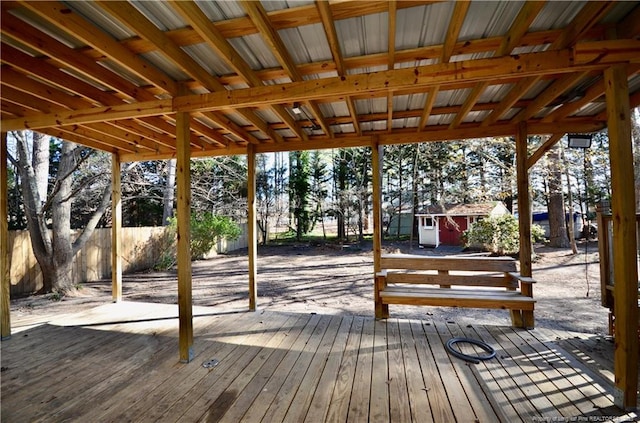 wooden terrace featuring a shed