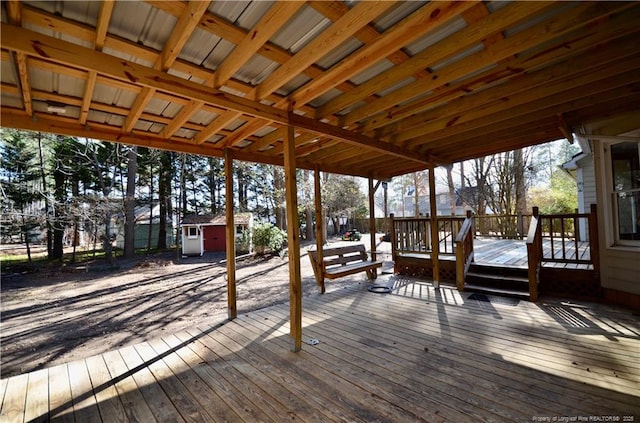 wooden terrace with a storage unit