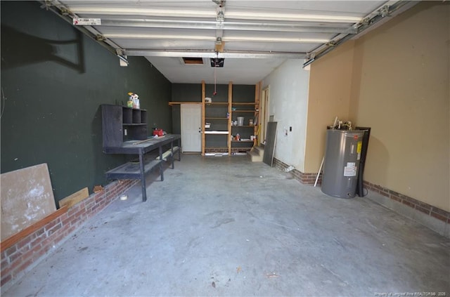 garage featuring water heater and a garage door opener