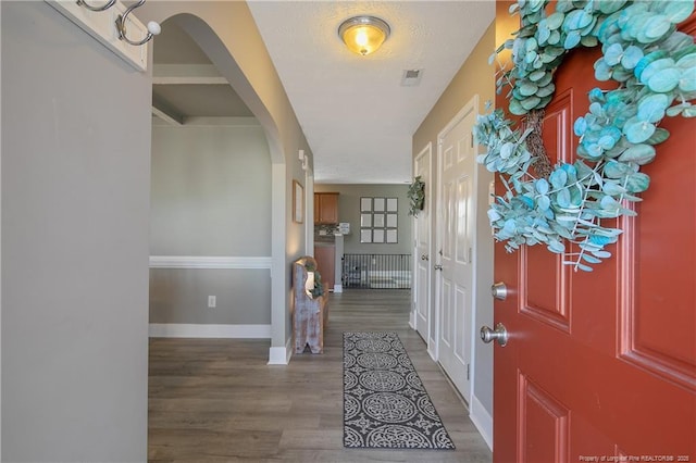 entrance foyer featuring hardwood / wood-style flooring and a textured ceiling