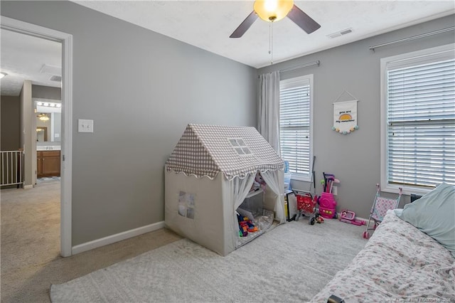 carpeted bedroom featuring ceiling fan