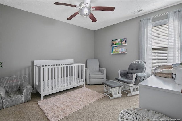 carpeted bedroom featuring ceiling fan