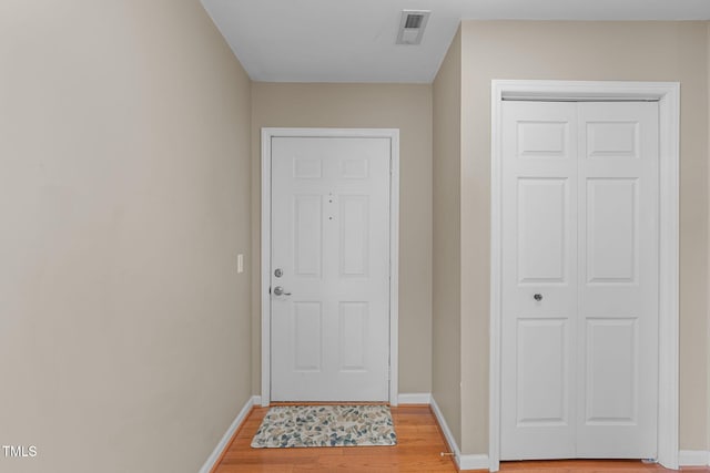 doorway featuring wood-type flooring