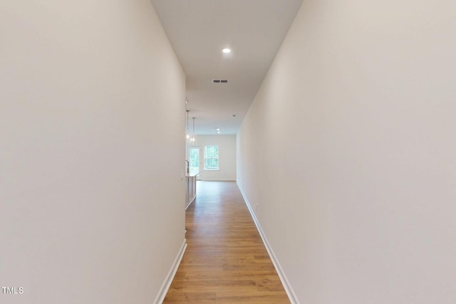 7117 Hubner Pl Unit 22, Cary, NC 27519 - corridor featuring light wood-type flooring and recessed lighting