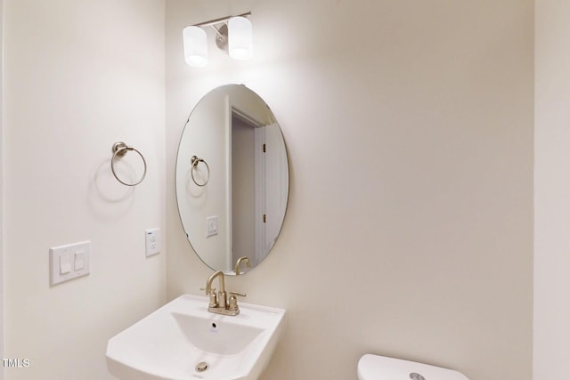 7117 Hubner Pl Unit 22, Cary, NC 27519 - half bath featuring a sink and toilet