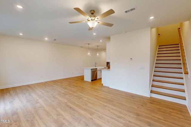 7117 Hubner Pl Unit 22, Cary, NC 27519 - unfurnished living room with stairway, ceiling fan, light wood-type flooring, and recessed lighting