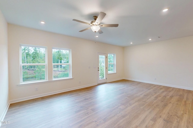 7117 Hubner Pl Unit 22, Cary, NC 27519 - empty room with light wood-style floors, a ceiling fan, and recessed lighting