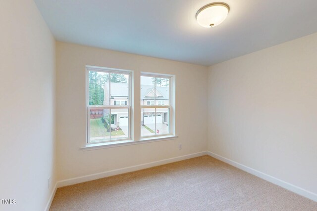 7117 Hubner Pl Unit 22, Cary, NC 27519 - spare room with baseboards and carpet floors