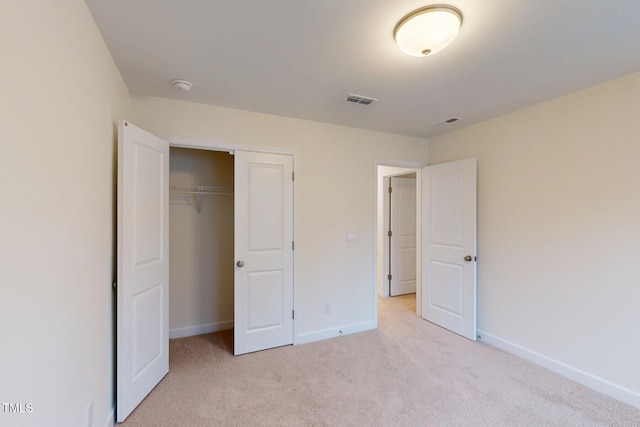 7117 Hubner Pl Unit 22, Cary, NC 27519 - unfurnished bedroom featuring light carpet and a closet