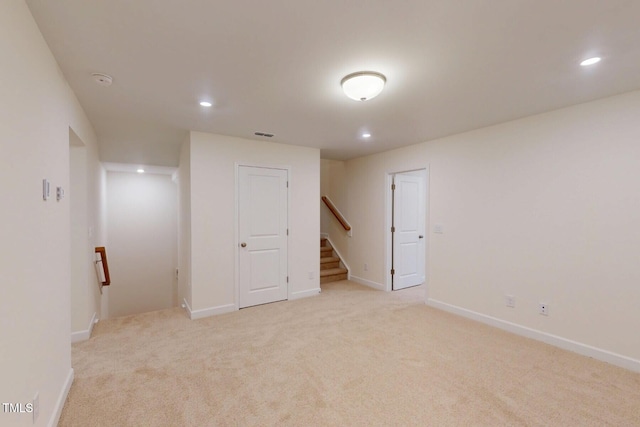 7117 Hubner Pl Unit 22, Cary, NC 27519 - finished below grade area featuring light carpet, recessed lighting, and stairway