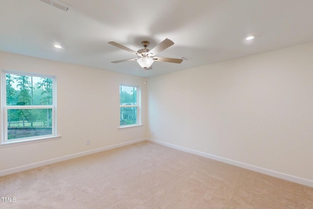 7117 Hubner Pl Unit 22, Cary, NC 27519 - spare room with light carpet, plenty of natural light, recessed lighting, and a ceiling fan