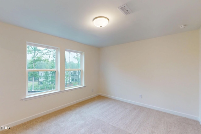 7117 Hubner Pl Unit 22, Cary, NC 27519 - carpeted spare room featuring baseboards and a smoke detector