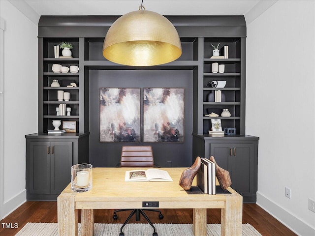 office space featuring built in shelves and dark wood-type flooring