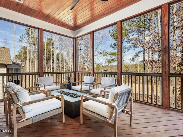 sunroom / solarium with wood ceiling and a healthy amount of sunlight